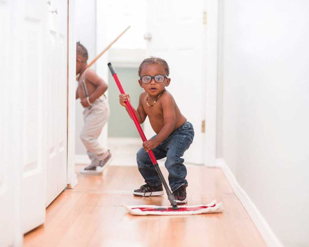 kid mopping floor