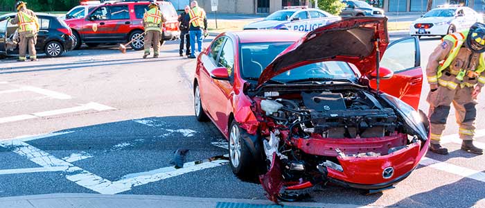 wrecked red car - 7 Factors to Consider When Hiring Car Accident Attorneys